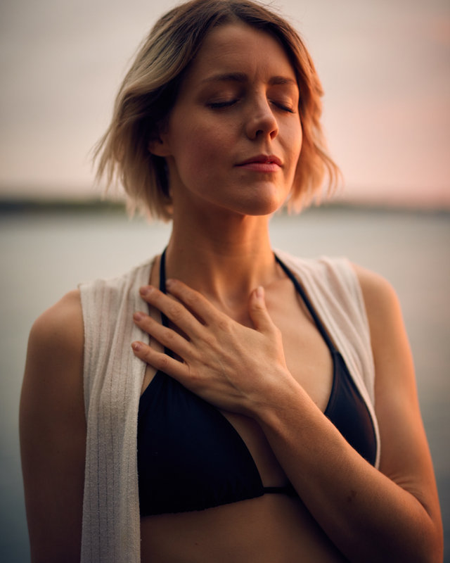 Woman with eyes closed enjoying a calm moment